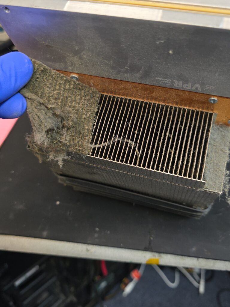XBOX X Series internal cleaning showing heavy dust buildup being removed from the console at iFix 757 in Virginia Beach.