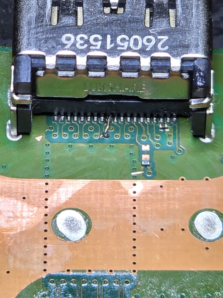 PlayStation 5 damaged HDMI trace repaired with a jumper wire during micosoldering at iFix 757 in Virginia Beach
