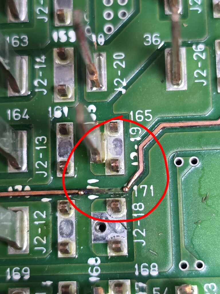 Broken printed circuit board trace before micosoldering jumper repair at iFix 757 in Virginia Beach.