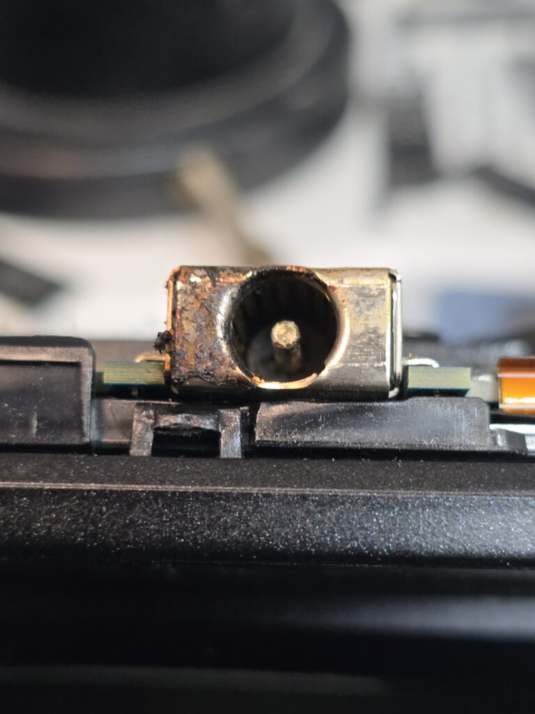 ASUS laptop DC jack / charge port before repair at iFix 757 in Virginia Beach.
