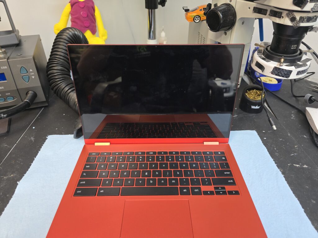 Liquid-damaged Chromebook laptop with a black screen and no power during diagnostic evaluation at iFix 757 in Virginia Beach