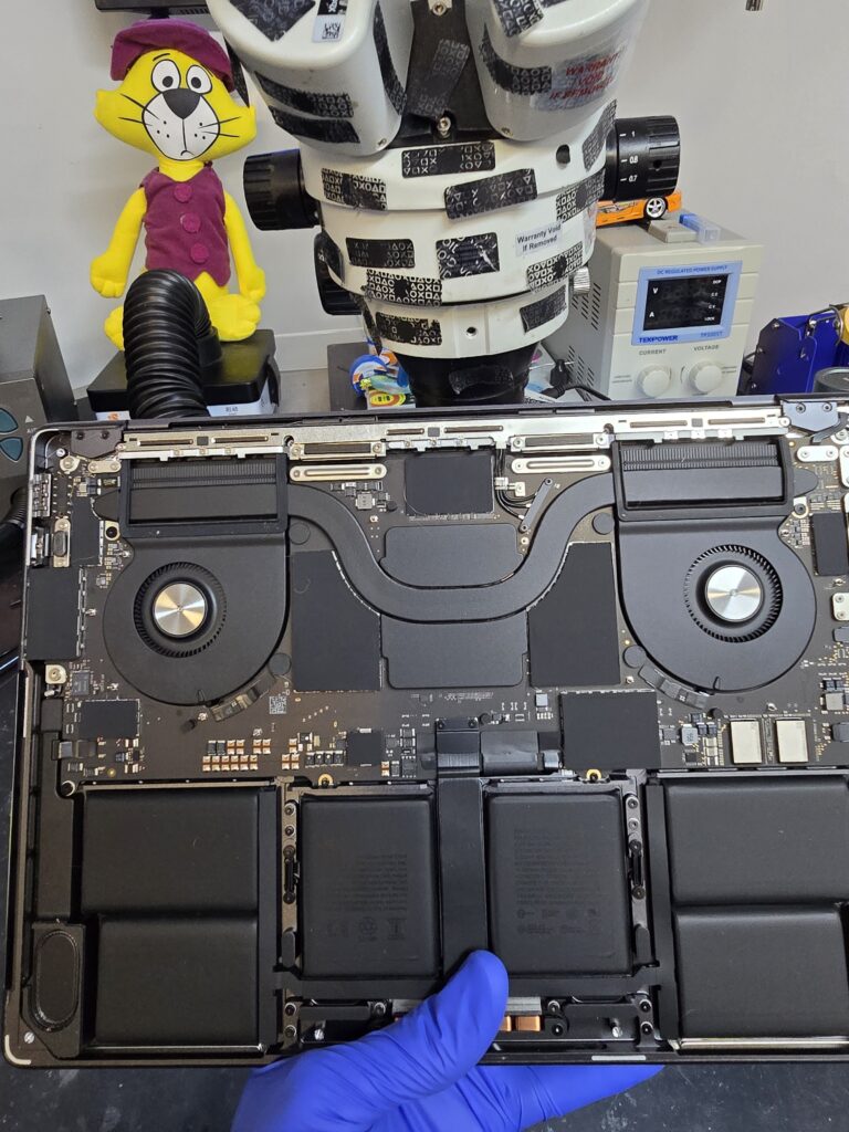 MacBook Pro no-power diagnostic with the laptop opended for internal troubleshooting at iFix 757 in Virginia Beach