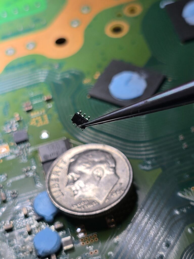 PlayStation 5 power switch IC removal and replacement for no video repair micosoldering at iFix 757 in Virginia Beach.